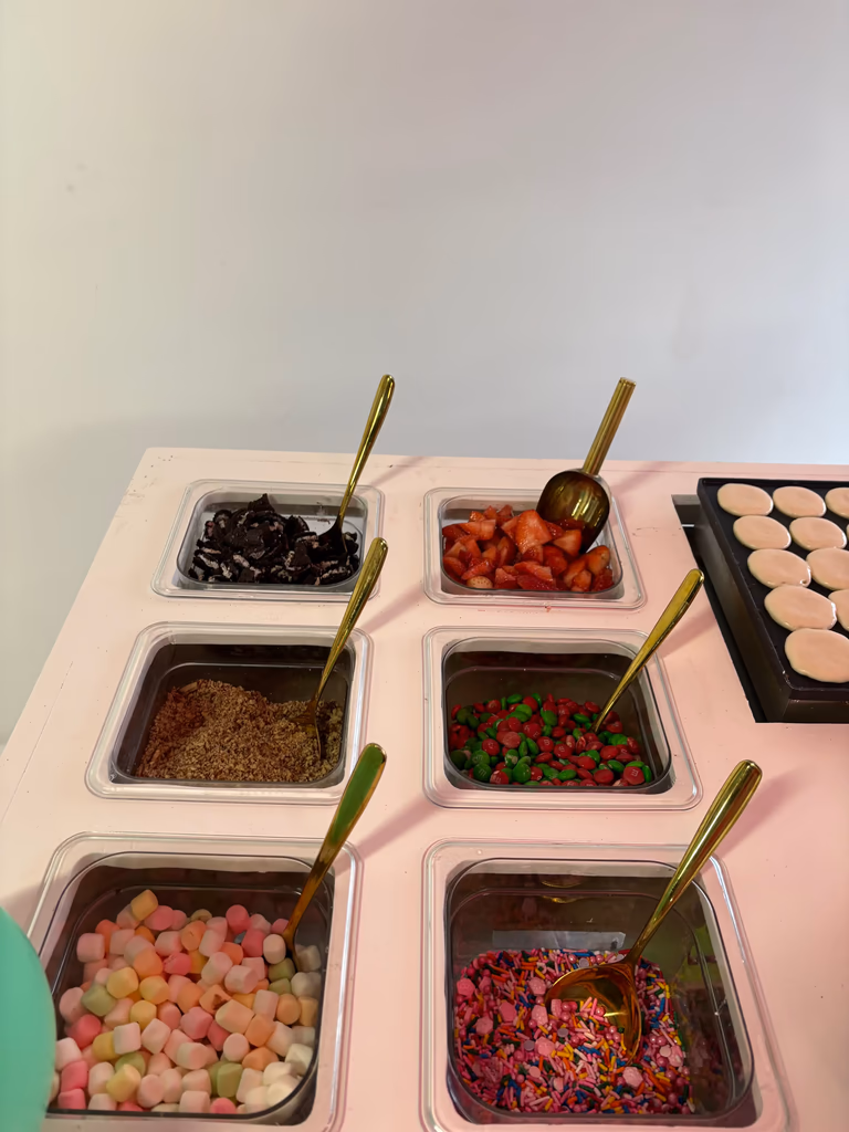 Toppings station with candy and fruits